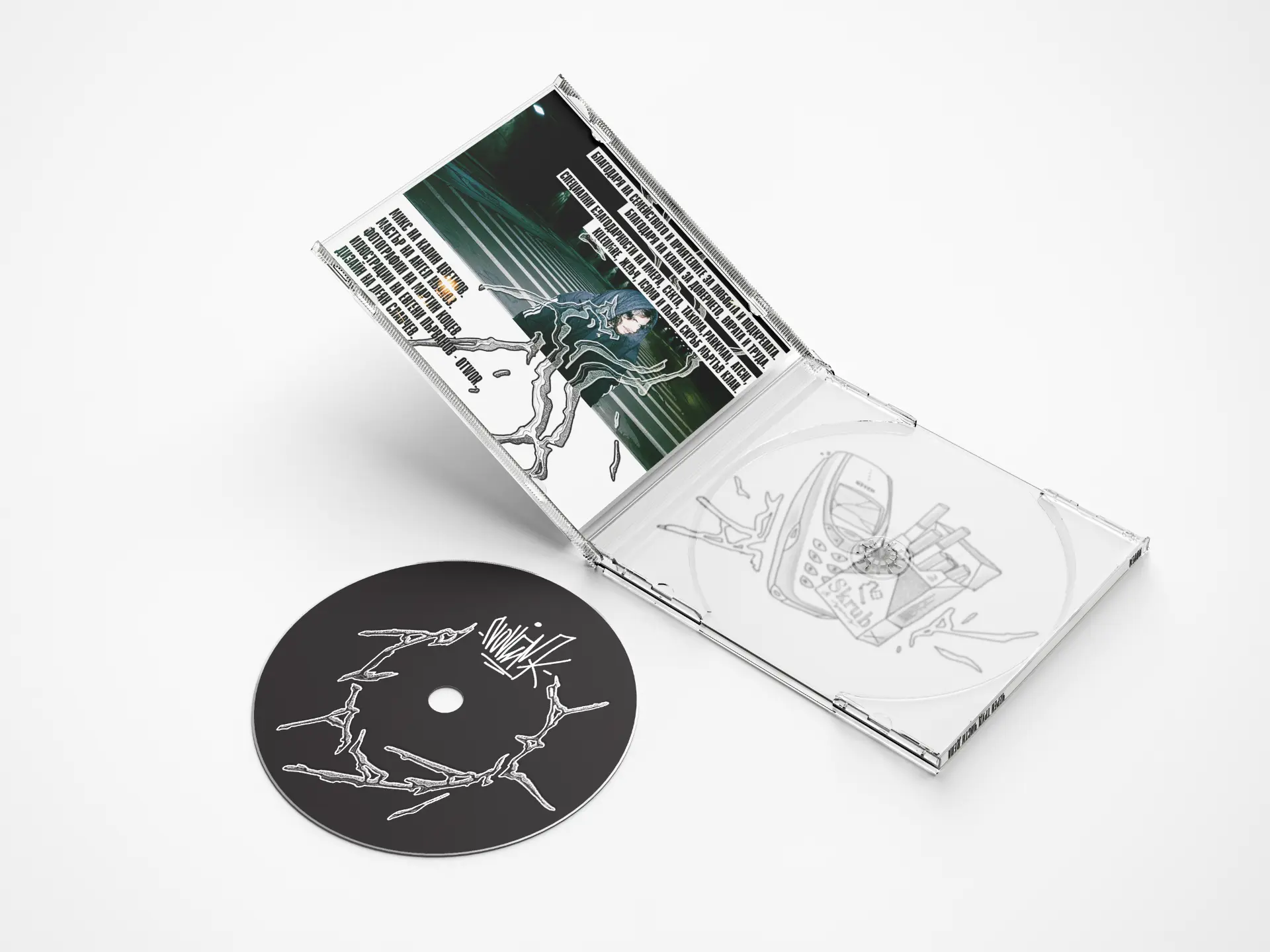 Open jewel case with printed disc and inlay artwork
