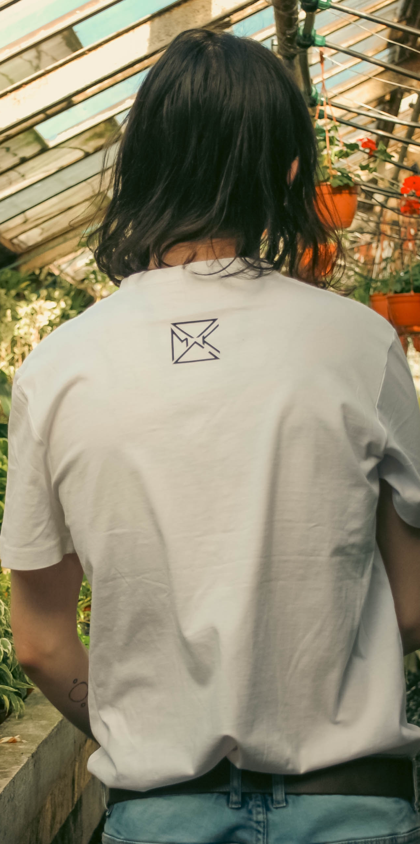 White T-shirt with the PSMK logo printed on the back